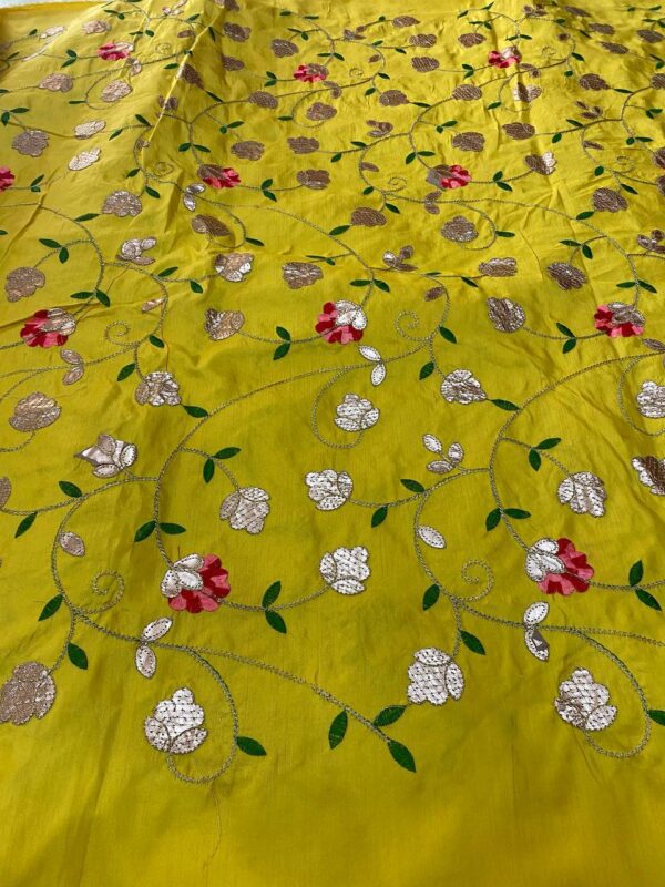 Soft silk fabric with intricate Gota embroidery, 44 inches wide, perfect for creating elegant and traditional outfits.