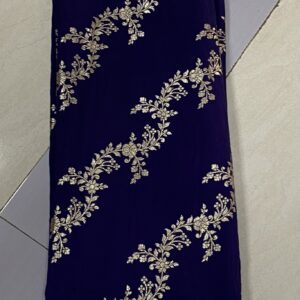 Pure Dola silk fabric in purple with intricate Banarasi style zari weaving, 44 inches wide, ideal for luxurious ethnic and traditional outfits.