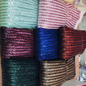 Imported Stretchable Power Net Sequin Fabric is perfect for luxurious creations. Explore our Designer Fabric Collection at Bollywood Fabric Store.