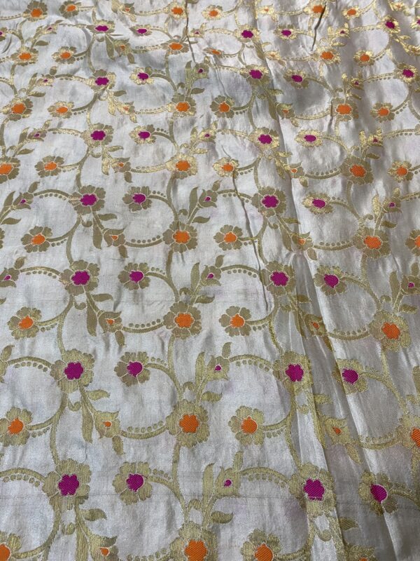 Enhance your creations with pure dyeable satin based Banarasi fabric, featuring Minakari weaving. 44-inch width, ₹250 per meter.