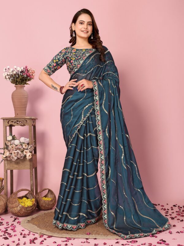 Stunning Party Wear Rangoli Silk Saree with intricate embroidery and sequence work. Comes with an unstitched embroidered blouse. ₹1125/-