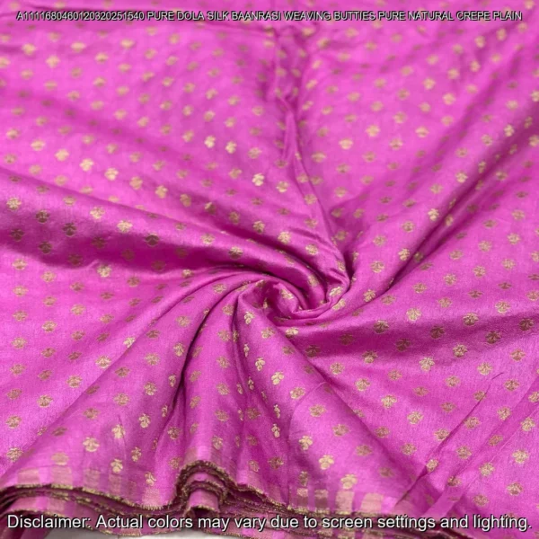 Soft & luxurious Pure Dola Silk Banarasi Fabric with elegant buttie weaving. Perfect for sarees & lehengas. Shop now at ₹440/M!