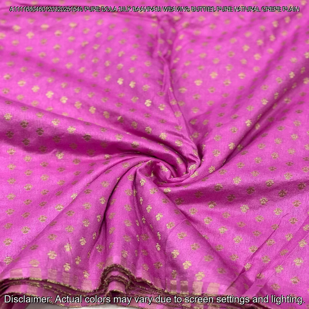 Soft & luxurious Pure Dola Silk Banarasi Fabric with elegant buttie weaving. Perfect for sarees & lehengas. Shop now at ₹440/M!