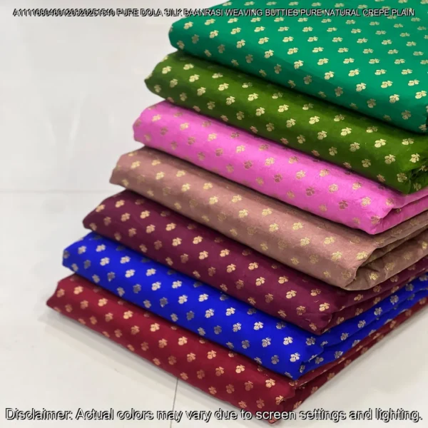 Soft & luxurious Pure Dola Silk Banarasi Fabric with elegant buttie weaving. Perfect for sarees & lehengas. Shop now at ₹440/M!