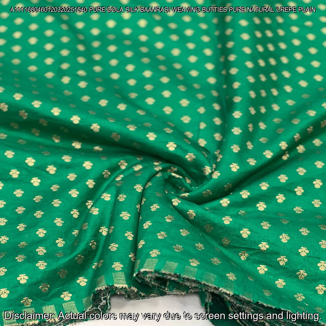 Soft & luxurious Pure Dola Silk Banarasi Fabric with elegant buttie weaving. Perfect for sarees & lehengas. Shop now at ₹440/M!