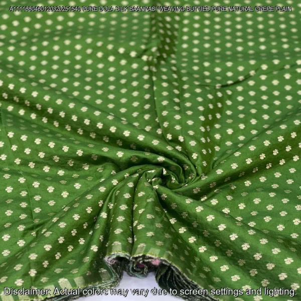 Soft & luxurious Pure Dola Silk Banarasi Fabric with elegant buttie weaving. Perfect for sarees & lehengas. Shop now at ₹440/M!