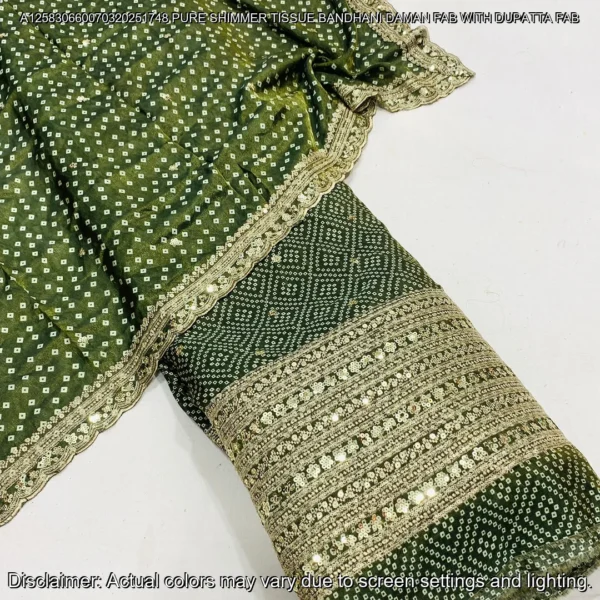 "Discover our luxurious Shimmer Tissue Silk Fabric with Bandhani Print, featuring sequins zari daman work and a matching dupatta. Perfect for elegant ensembles."