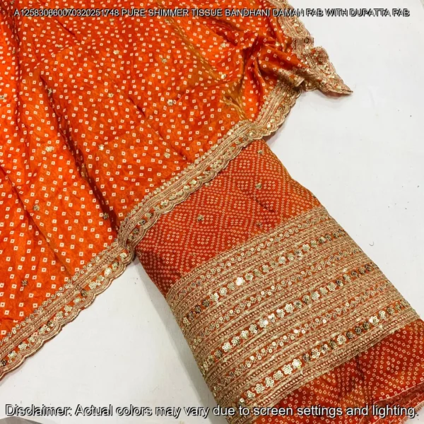 "Discover our luxurious Shimmer Tissue Silk Fabric with Bandhani Print, featuring sequins zari daman work and a matching dupatta. Perfect for elegant ensembles."