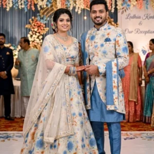 Shimmer tissue silk floral printed ethnic wear fabric featuring couple in matching lehenga choli and kurta sherwani outfit reference